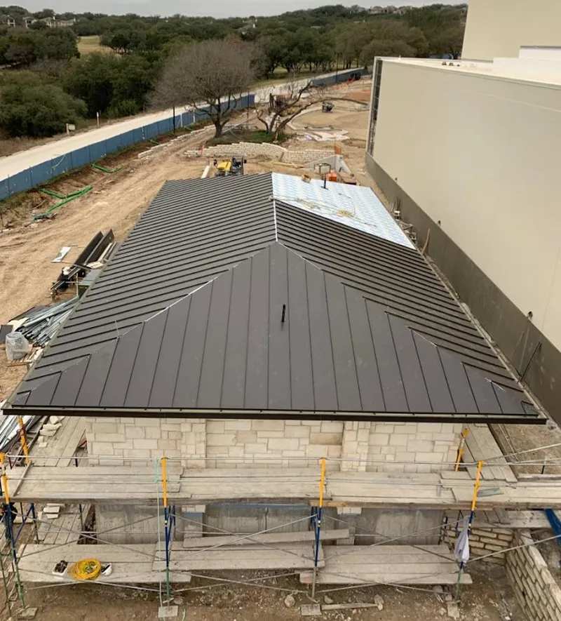 Metal roof new construction with scaffolding in Webster